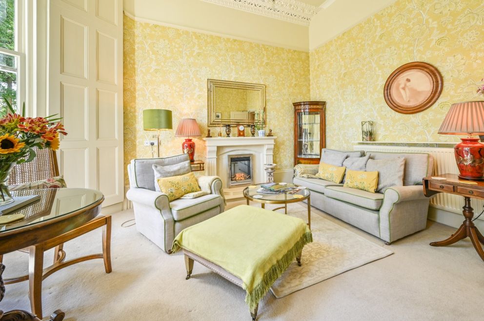 The Muntham Luxury Holiday Apartments in Torquay - Apartment 2 living room with seating area and dining area.